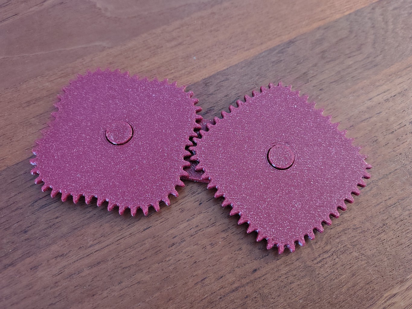 3D-printed purple gear pair